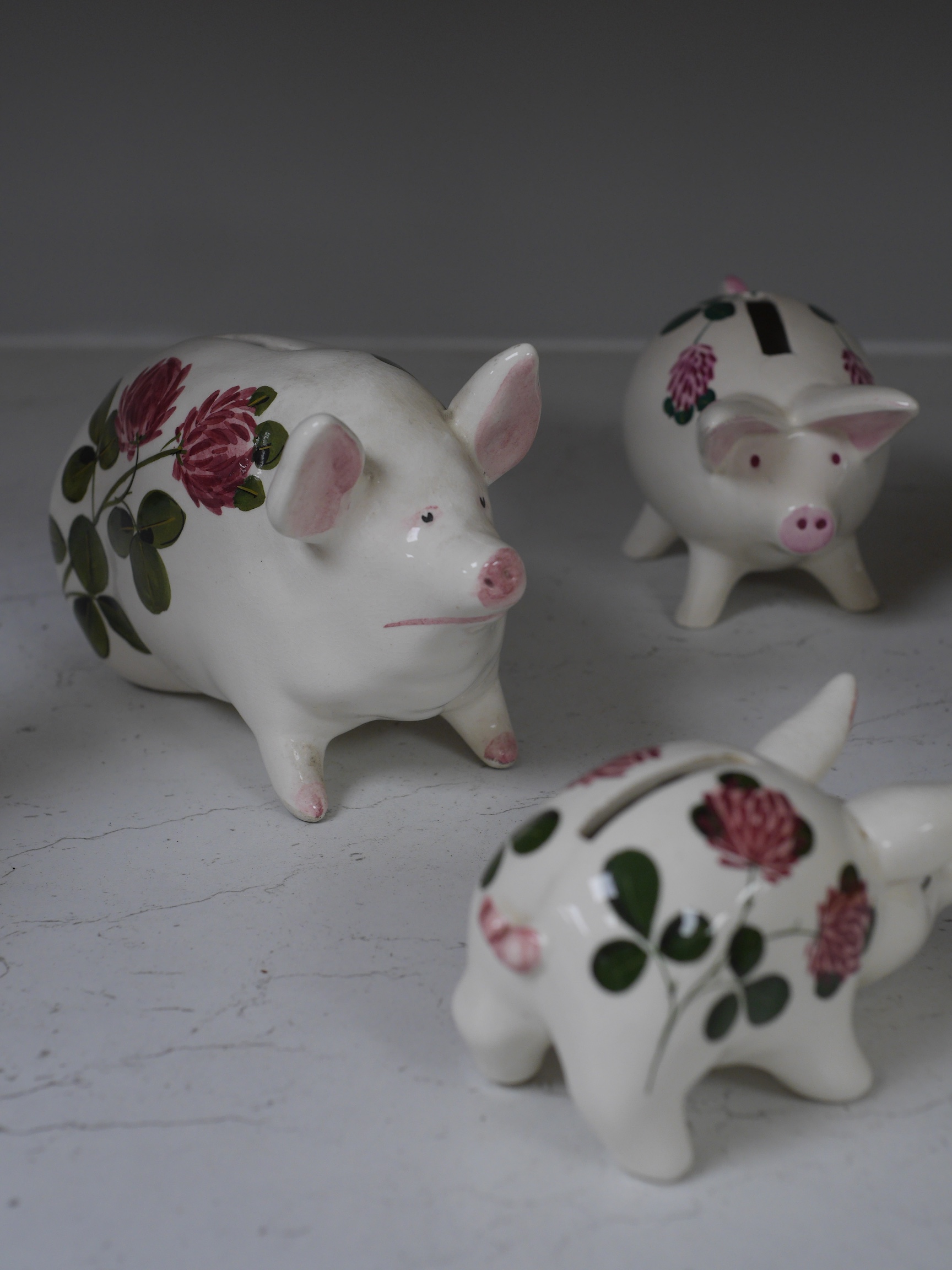 Three Plichta ‘pig’ ceramic money banks, each stamped to the bases, largest 16cm wide. Condition - fair